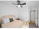 Bright bedroom has a brass bed frame, neutral carpet, and neutral paint at 2160 Via Vita St, Mount Charleston, NV 89124