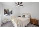 Bright bedroom has a brass bed frame, neutral carpet, and large window with views at 2160 Via Vita St, Mount Charleston, NV 89124