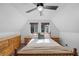 Bright bedroom with wooden furniture, neutral carpet, and large windows with views at 2160 Via Vita St, Mount Charleston, NV 89124
