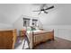 Bright bedroom with wooden furniture, neutral carpet, and large windows with views at 2160 Via Vita St, Mount Charleston, NV 89124