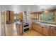 Open kitchen with stainless steel appliances, island gas cooktop, and views of the dining room at 2160 Via Vita St, Mount Charleston, NV 89124