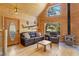 Cozy living room features wood paneling, wood-burning stove, and comfortable seating at 2160 Via Vita St, Mount Charleston, NV 89124