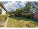 Beautiful backyard features a well-manicured lawn and covered patio at 240 Jumping Springs Pl, Henderson, NV 89012