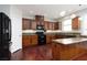 Well-equipped kitchen featuring ample cabinet space and granite countertops at 240 Jumping Springs Pl, Henderson, NV 89012