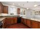 Kitchen boasts granite countertops, stylish pendant lights, and plantation shutters at 240 Jumping Springs Pl, Henderson, NV 89012