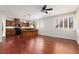 Open-concept area features hardwood floors, seamlessly connecting the kitchen and living area at 240 Jumping Springs Pl, Henderson, NV 89012