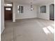 Bright living room with carpet, shuttered windows, and an elegant chandelier at 240 Jumping Springs Pl, Henderson, NV 89012