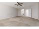 Spacious carpeted primary bedroom with adjoining arched bathroom entry for convenience and privacy at 240 Jumping Springs Pl, Henderson, NV 89012