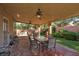Cozy covered patio with brick flooring, ideal for outdoor dining and relaxing at 240 Jumping Springs Pl, Henderson, NV 89012
