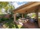Charming covered patio with brick flooring and ample space for outdoor dining and entertaining at 240 Jumping Springs Pl, Henderson, NV 89012