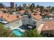 Back of charming home featuring a pool, landscaping, and outdoor dining area near downtown at 2712 Sidonia Ave, Las Vegas, NV 89102