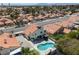 Back of charming home featuring a pool, landscaping, and outdoor dining area at 2712 Sidonia Ave, Las Vegas, NV 89102