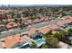 Neighborhood aerial view featuring backyard pools, mature landscaping, and red-tiled roofs at 2712 Sidonia Ave, Las Vegas, NV 89102