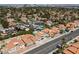 A residential neighborhood is seen from an aerial view with mature shade trees and desert landscaping at 2712 Sidonia Ave, Las Vegas, NV 89102