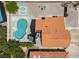 Aerial view of backyard showing a uniquely shaped pool, sunning deck, and outdoor seating area at 2712 Sidonia Ave, Las Vegas, NV 89102