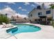 Enjoy the beautiful backyard pool with a tanning shelf and outdoor bar for ultimate relaxation at 2712 Sidonia Ave, Las Vegas, NV 89102