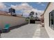 Gravel backyard featuring a quaint seating area with mountain views beyond the privacy gate at 2712 Sidonia Ave, Las Vegas, NV 89102