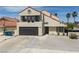 Charming two-story home featuring a balcony, desert landscaping, and a two-car garage at 2712 Sidonia Ave, Las Vegas, NV 89102