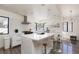 Bright modern kitchen features stainless appliances, a large island, and a sleek tile backsplash at 2712 Sidonia Ave, Las Vegas, NV 89102