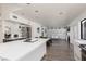 Spacious open floor plan features a kitchen island with seating, a dining area, and cabinetry at 2712 Sidonia Ave, Las Vegas, NV 89102