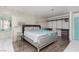 A stylish main bedroom features decorative wallpaper, a walk-in closet and en-suite bathroom with a soaking tub at 2712 Sidonia Ave, Las Vegas, NV 89102
