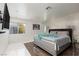 Bright bedroom featuring hardwood floors, stylish wallpaper, and modern design at 2712 Sidonia Ave, Las Vegas, NV 89102
