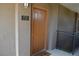 Close-up of unit 1733 front door with black hardware and neutral color at 2900 Sunridge Heights Pkwy # 1733, Henderson, NV 89052