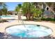 Community hot tub with tropical landscaping and a nearby swimming pool for residents to enjoy at 2900 Sunridge Heights Pkwy # 1733, Henderson, NV 89052