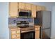 Updated kitchen with stainless steel appliances, granite countertops, and wood cabinets at 2900 Sunridge Heights Pkwy # 1733, Henderson, NV 89052