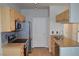 Modern kitchen with stainless steel appliances, granite countertops, and wood cabinets at 2900 Sunridge Heights Pkwy # 1733, Henderson, NV 89052