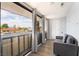 Small bonus room or balcony with a gray futon and large windows at 3120 S Eastern Ave # 6, Las Vegas, NV 89169