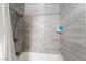 Stylish bathroom with tiled shower and tub, featuring modern fixtures and a shower dispenser at 3120 S Eastern Ave # 6, Las Vegas, NV 89169