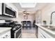 Modern kitchen with stainless steel appliances that is open to dining room and lots of light at 3120 S Eastern Ave # 6, Las Vegas, NV 89169