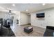Bright living room featuring hardwood floors, comfortable seating, and a sliding glass door to the dining area at 3120 S Eastern Ave # 6, Las Vegas, NV 89169