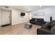 Cozy living room with hardwood floors, comfortable couches, and a view of the entrance at 3120 S Eastern Ave # 6, Las Vegas, NV 89169