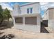 Two-story home featuring a balcony and screened-in windows, surrounded by a block fence at 3132 Centavo Dr, Las Vegas, NV 89117