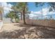 Large backyard with mature trees and a block fence at 3132 Centavo Dr, Las Vegas, NV 89117