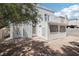 Exterior view of a two-story home featuring a balcony and fenced backyard at 3132 Centavo Dr, Las Vegas, NV 89117