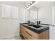 Modern bathroom with a dual sink vanity, sleek black fixtures, and ample counter space at 3132 Centavo Dr, Las Vegas, NV 89117