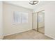 Bright bedroom featuring tile flooring and a mirrored closet at 3132 Centavo Dr, Las Vegas, NV 89117