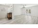 Spacious bedroom with double doors, wood-look flooring, and bathroom vanity at 3132 Centavo Dr, Las Vegas, NV 89117