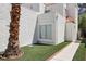 Charming exterior view highlighting the manicured grass and beautiful desert landscaping at 3132 Centavo Dr, Las Vegas, NV 89117