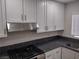 Close up of the kitchen area featuring stainless steel appliances, granite countertops, and white cabinets at 3132 Centavo Dr, Las Vegas, NV 89117