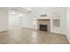 Spacious living room featuring lots of natural light, a cozy fireplace, and tile floors at 3132 Centavo Dr, Las Vegas, NV 89117