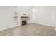 Bright living room with large windows, a cozy fireplace, and tile floors at 3132 Centavo Dr, Las Vegas, NV 89117