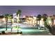 Evening view of commercial businesses and mature palm trees at 3132 Centavo Dr, Las Vegas, NV 89117
