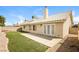 Spacious backyard featuring a patio and a well-manicured lawn, perfect for outdoor relaxation at 3214 W Gilmore Ave, North Las Vegas, NV 89032