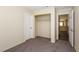 Bedroom featuring a standard closet, neutral walls, and carpet at 3214 W Gilmore Ave, North Las Vegas, NV 89032