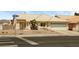 Charming single-story home featuring a xeriscaped yard, tile roof, and attached two-car garage at 3214 W Gilmore Ave, North Las Vegas, NV 89032
