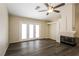 Bright living area with a fireplace, ceiling fan, recessed lights and glass doors to the exterior at 3214 W Gilmore Ave, North Las Vegas, NV 89032